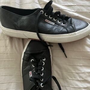 Nice clean black leather Superga sneakers.